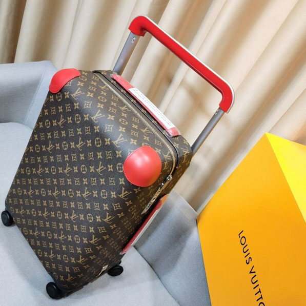 Vali hoa nâu Louis Vuitton viền da đỏ VIP